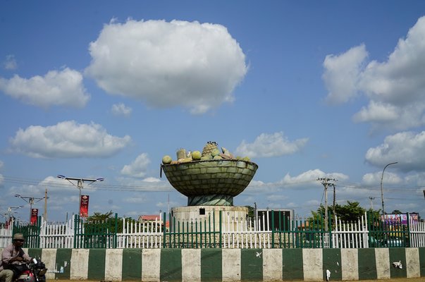 a roundabout in makurdi with sculpture basket with fruits inside