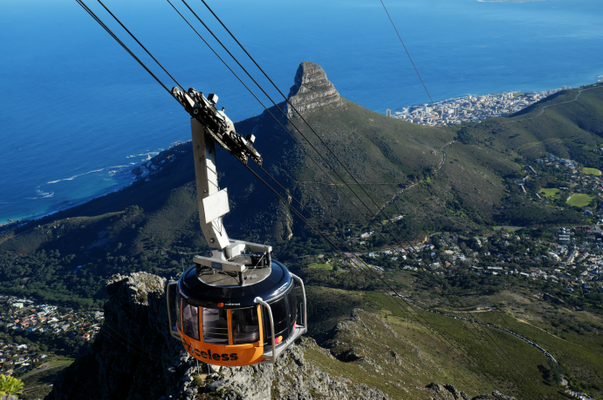 a cable car gliding towards table mountain