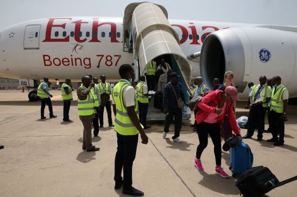 Passengers alighting from Ethiopian airplane