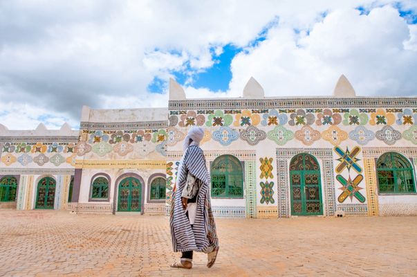 A man in the Emir of Kano's courtyard