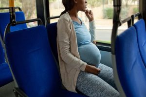 pregnant black woman in a bus