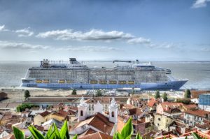 A ship anchored by a town